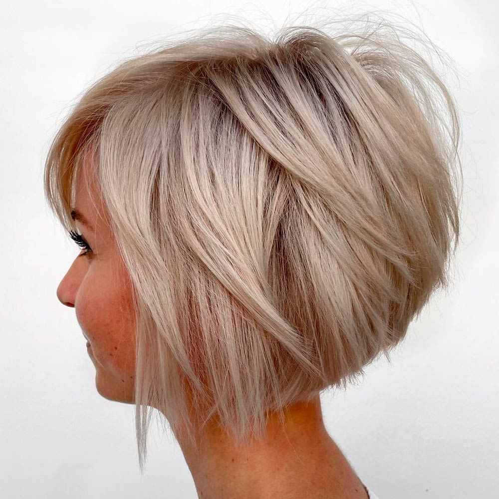 Messy layered blond bob with bangs